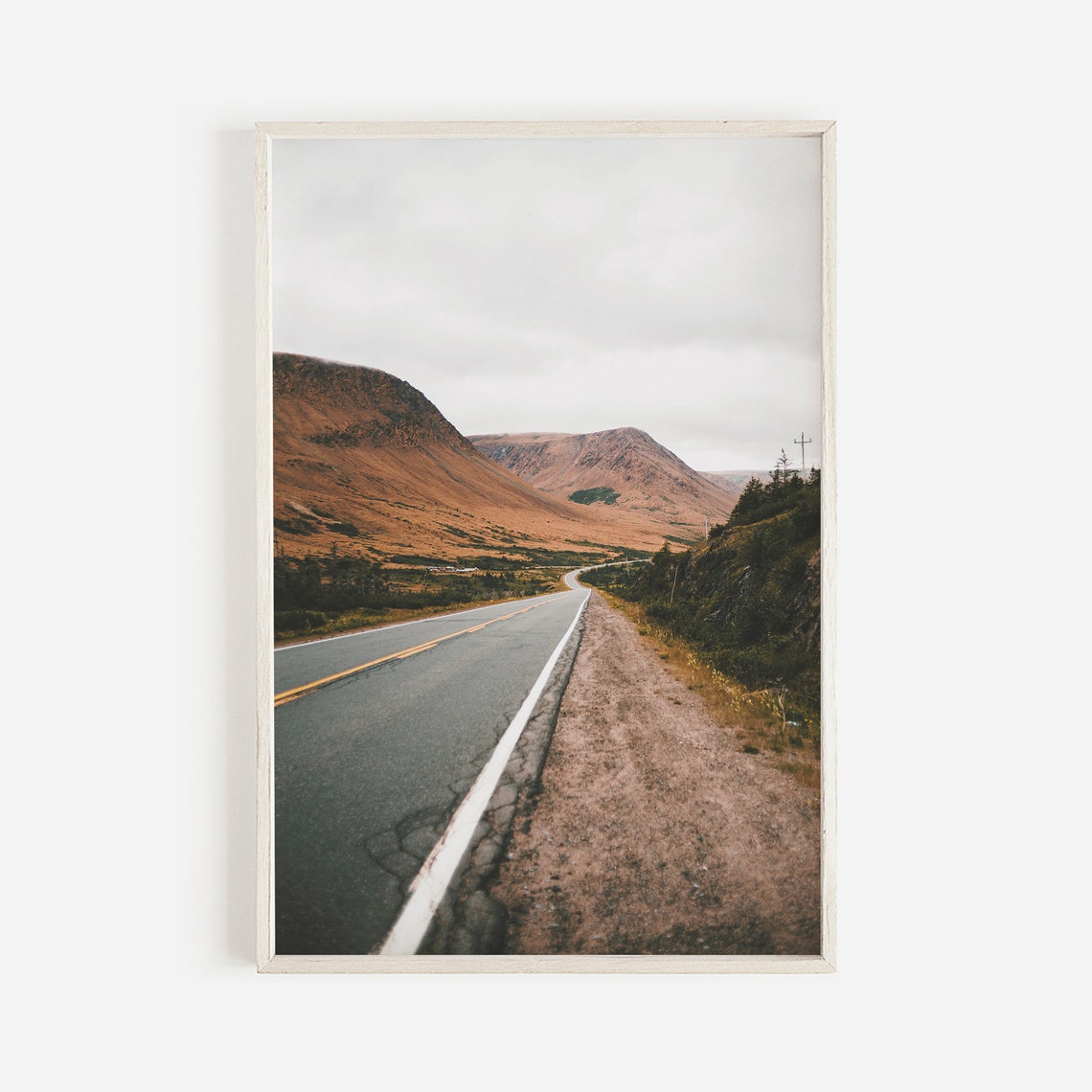 Winding Road Through Barren Highlands In Soft Gray Light Poster