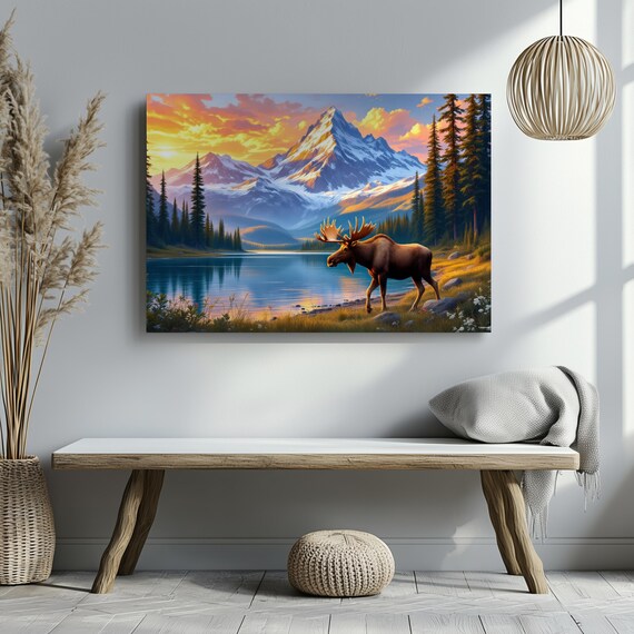 Moose Walking A Lakeside Meadow At Fiery Sunset With Snowy Peaks Poster