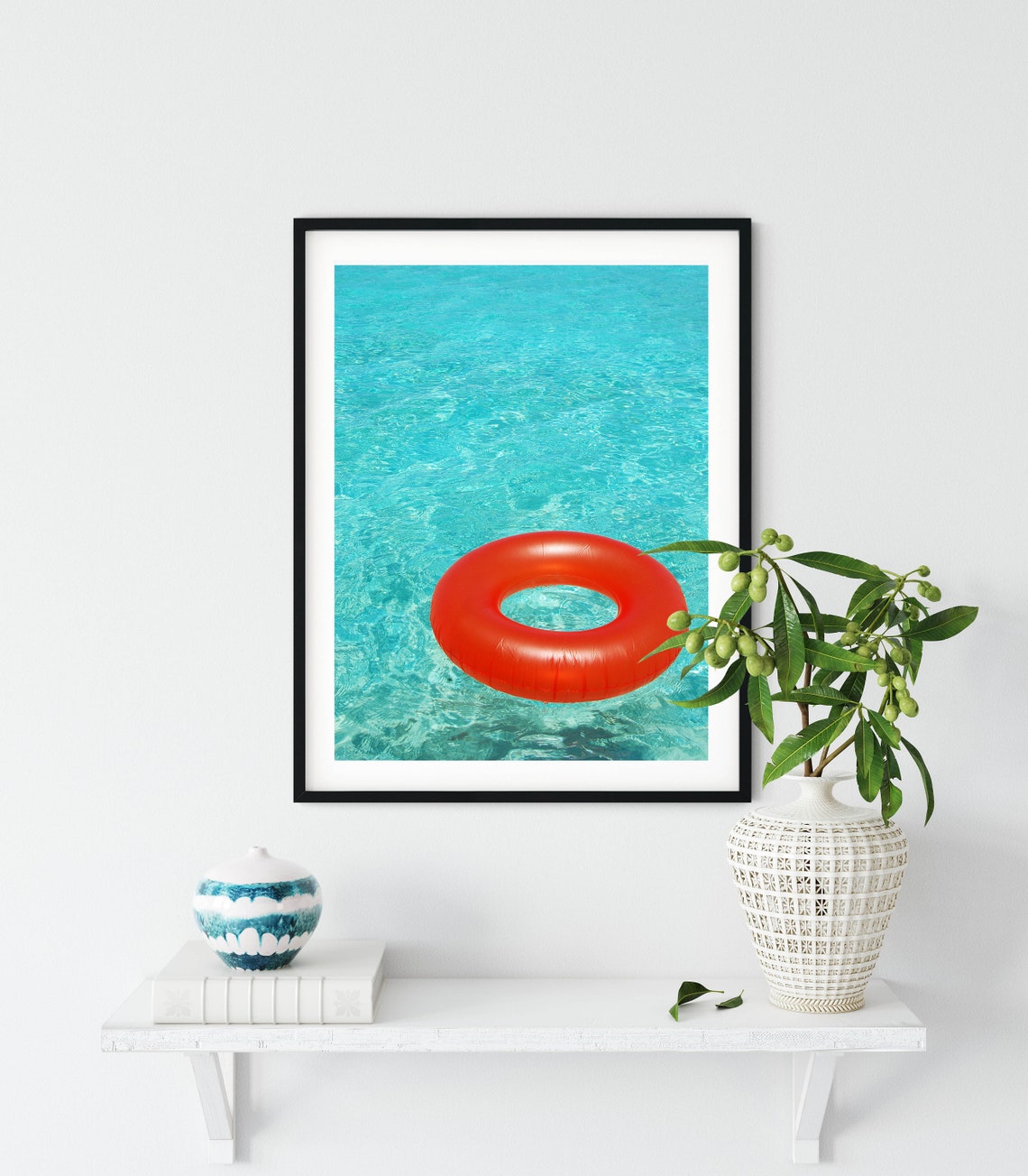 Bright Orange Pool Float Ring Floating in Turquoise Water Poster - Image 3
