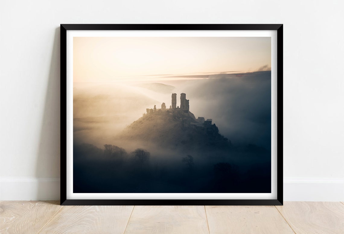 Medieval Castle Ruins on a Hilltop Above Thick Sea Fog Poster
