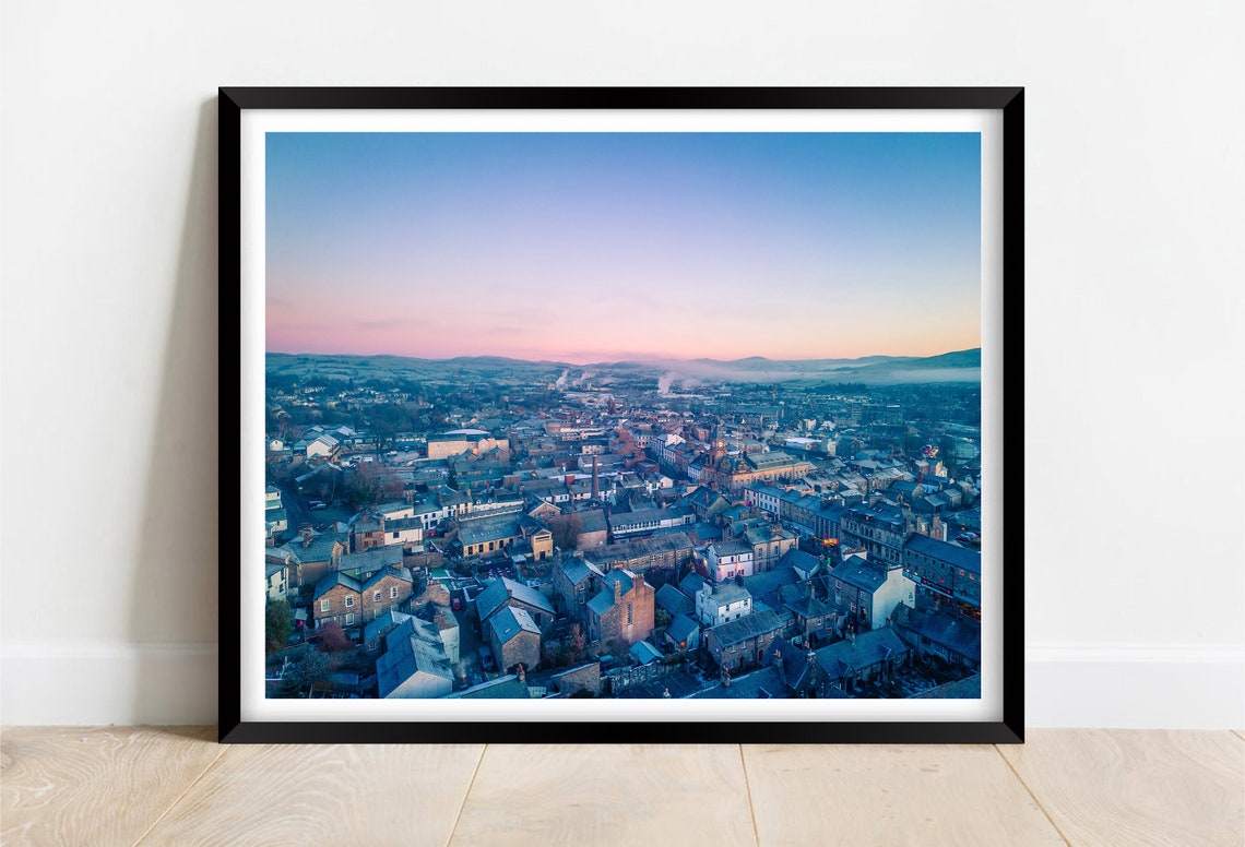 Aerial View of a Historic Old Town and Its Rooftops at Dawn Poster