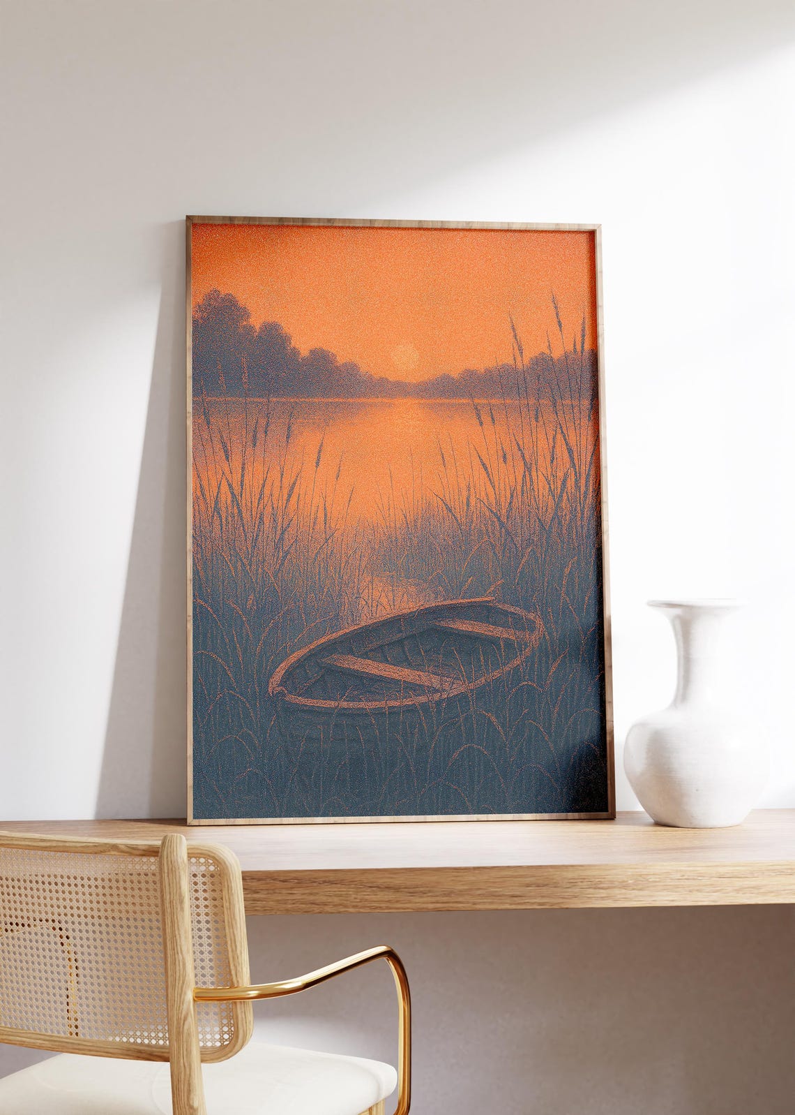 Wooden Rowboat resting in Tall Reeds by Lake at Sunset Poster