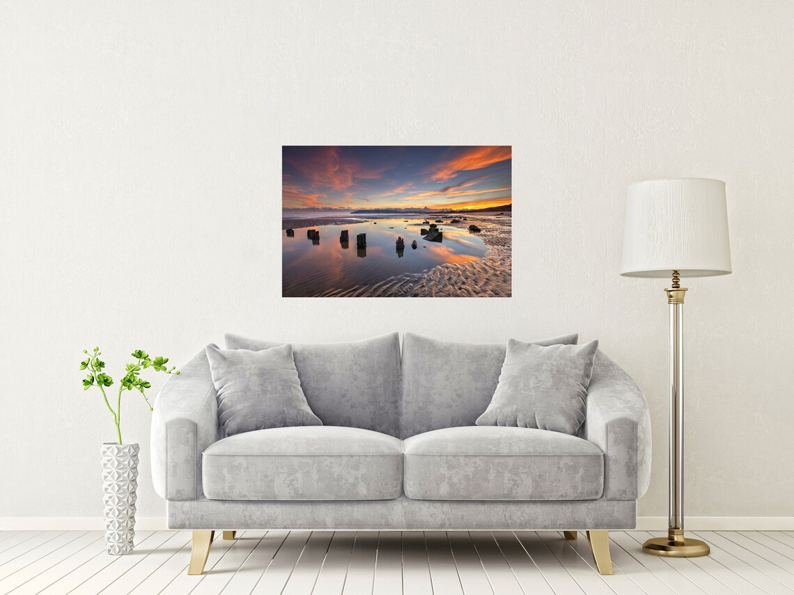 Old Wooden Groynes on Wet Sand at Sunset with Reflections Poster - Image 2