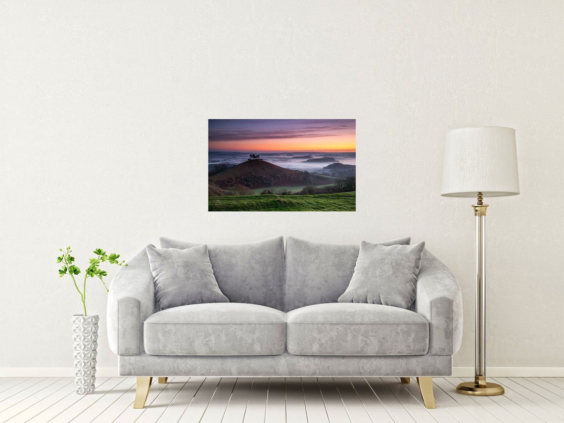 Sunrise Over a Misty Valley With Lone Trees on a Green Hilltop Poster - Image 2