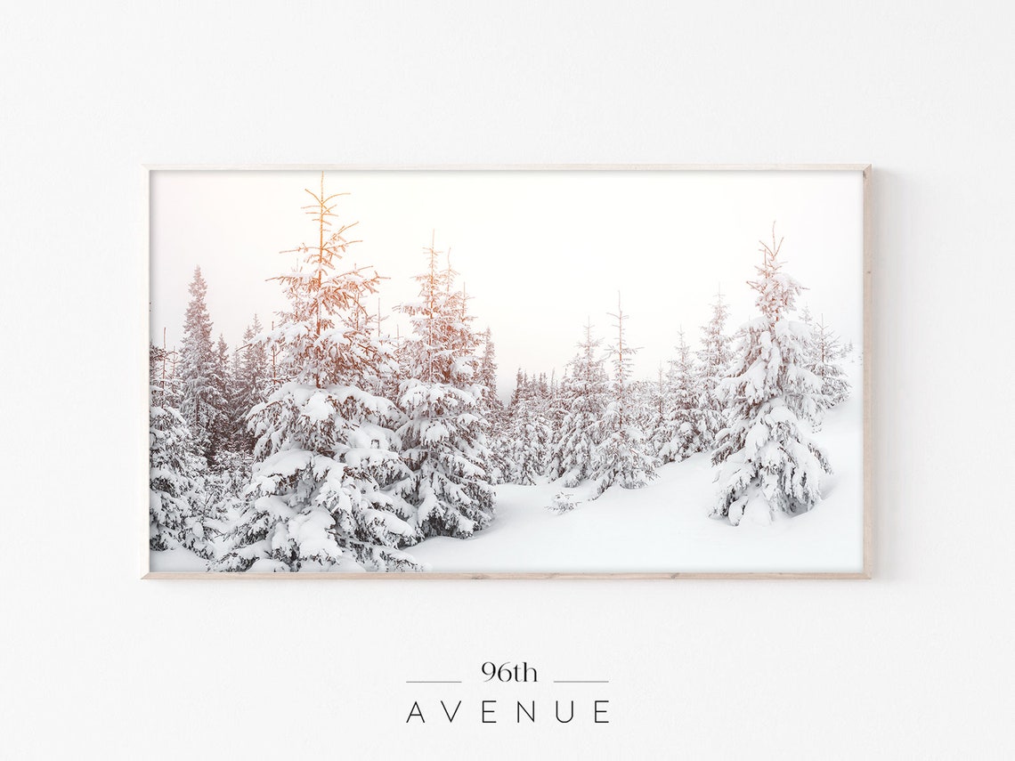 Snowy Pine Forest at Sunrise with Warm Morning Light Glow Poster