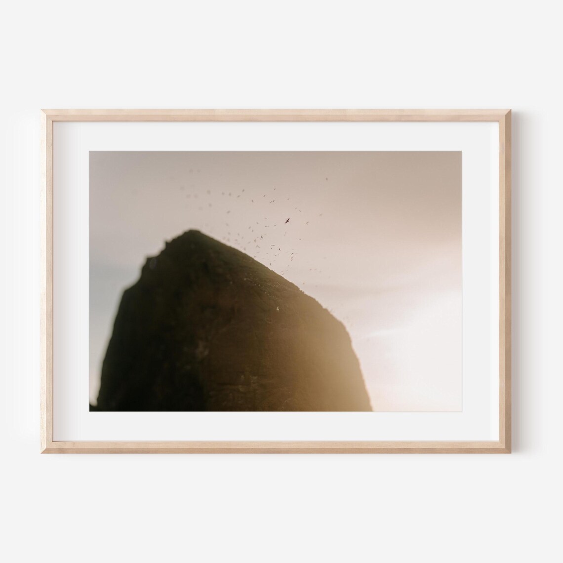 Haystack Rock Silhouette Against a Golden Oregon Sunset Poster