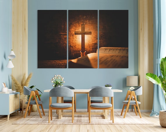Wooden Cross Standing On Open Bible Warm Candlelight Glow Spiritual Poster