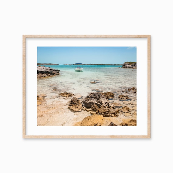 Anchored Boat in Crystal Clear Shallow Water Rocky Cove Poster