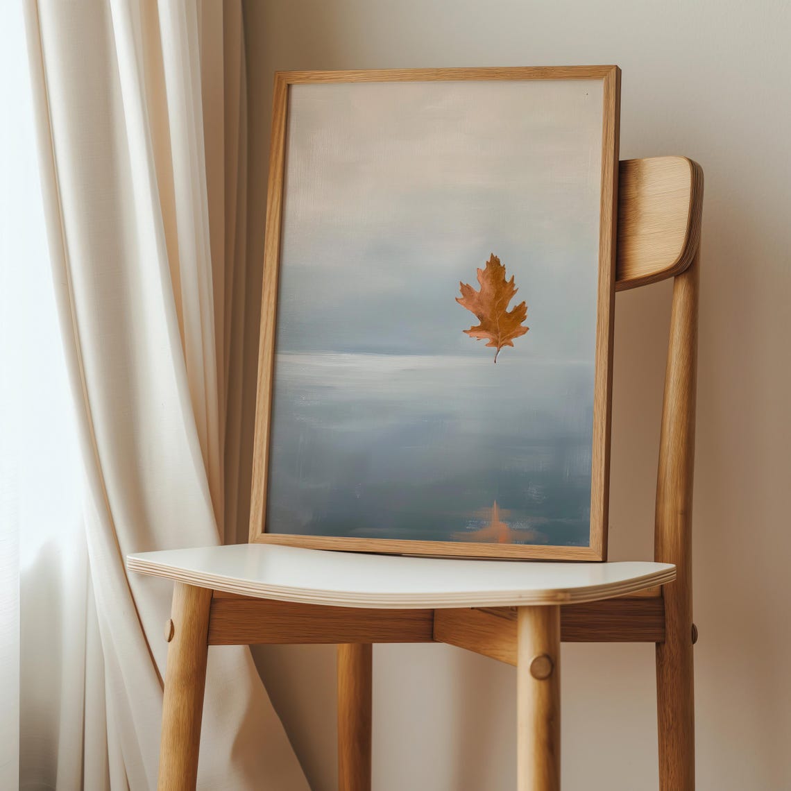 Single Autumn Oak Leaf Floating Above a Calm Grey Sea Poster
