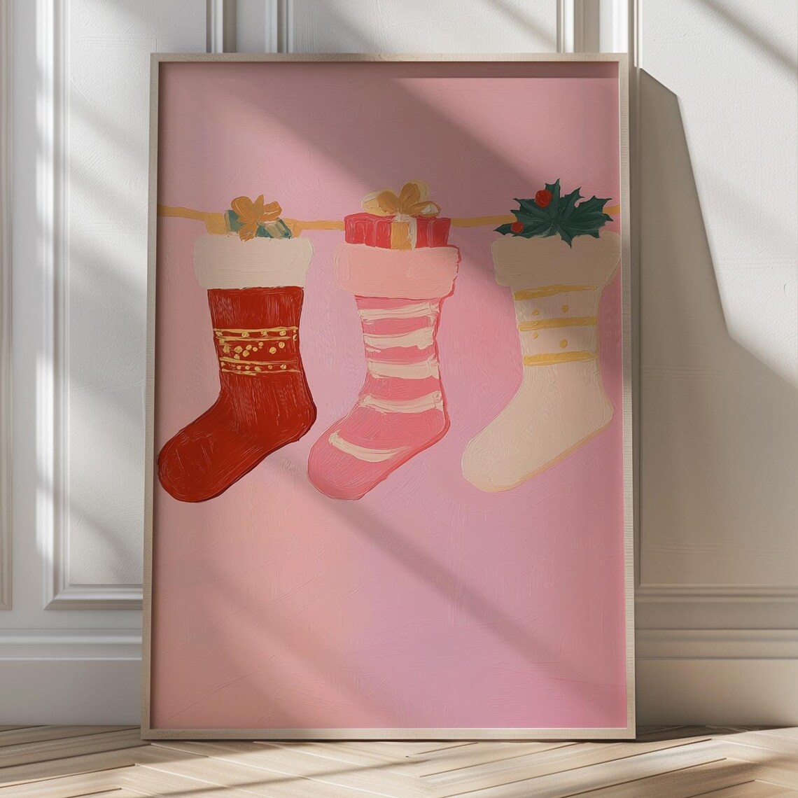 Three Christmas Stockings Hanging On Garland Pink Holiday Poster