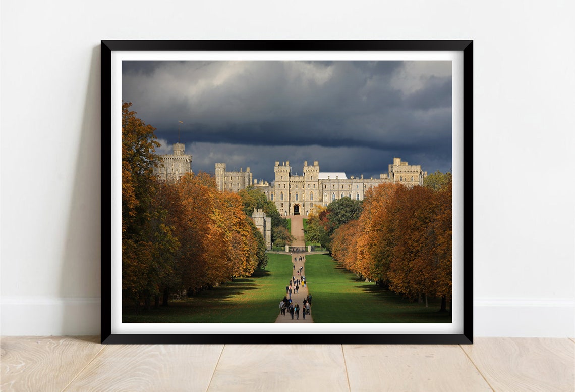 Windsor Castle Framed by Autumn Trees Under Dark Storm Clouds Poster