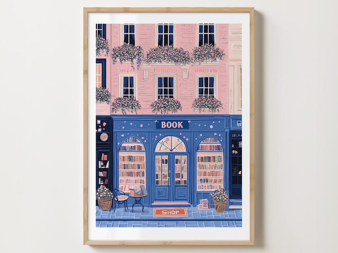 Blue Bookshop Storefront With Pink Building And Cafe Table Poster