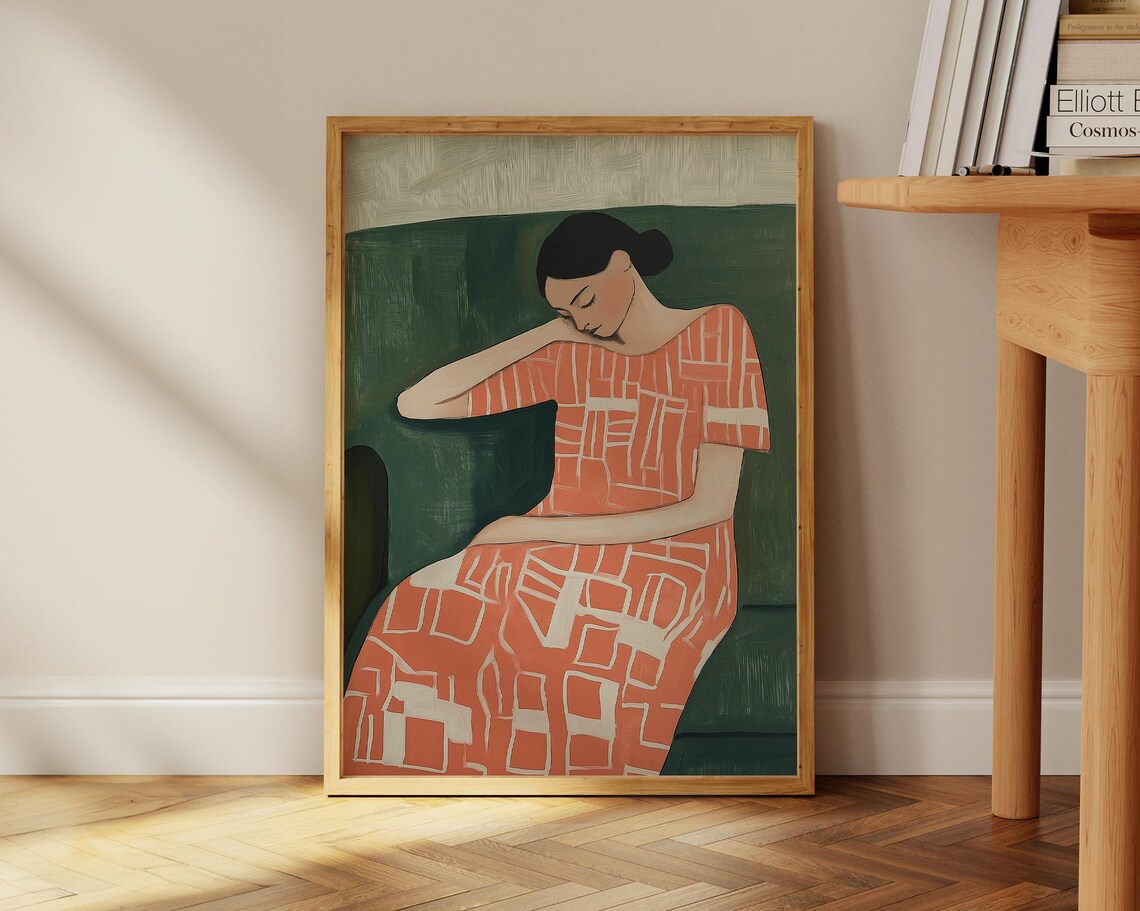 Resting Woman In A Coral Patterned Dress Against Deep Green Wall Art - Image 2