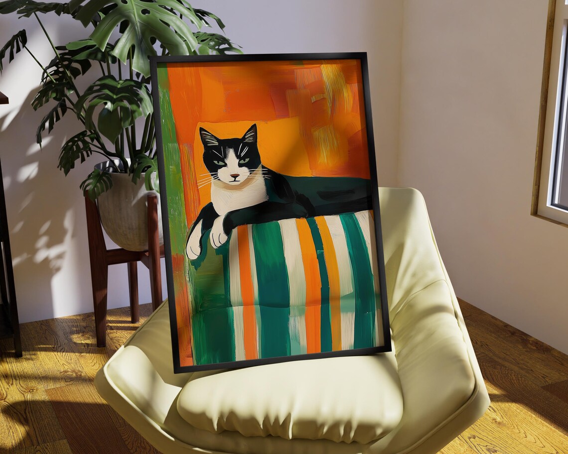 Tuxedo Cat Resting On A Striped Blanket With Warm Orange Wall Art - Image 2