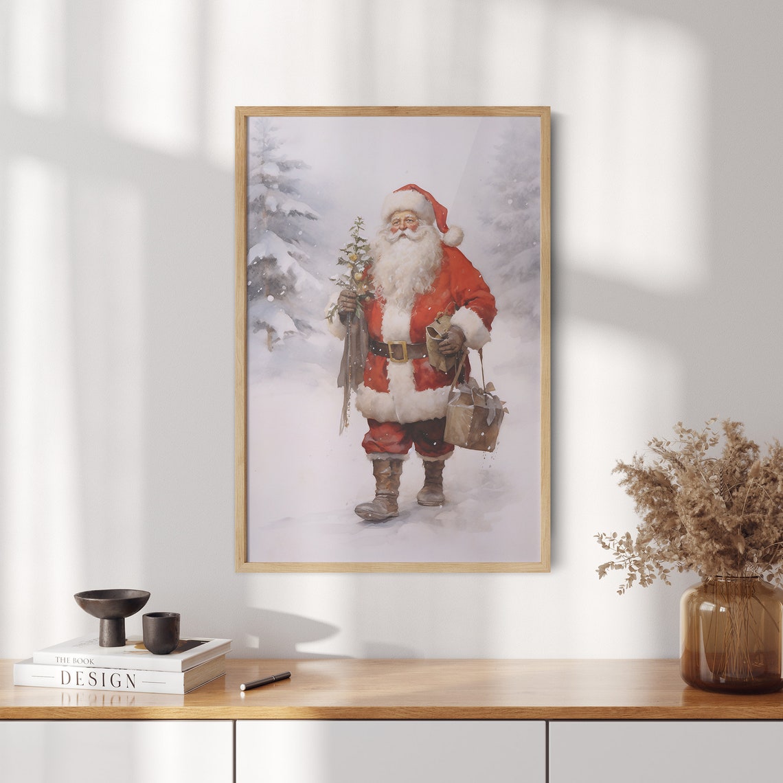 Santa Claus Carrying a Small Tree and Gift Bag Through Snow Poster - Image 2