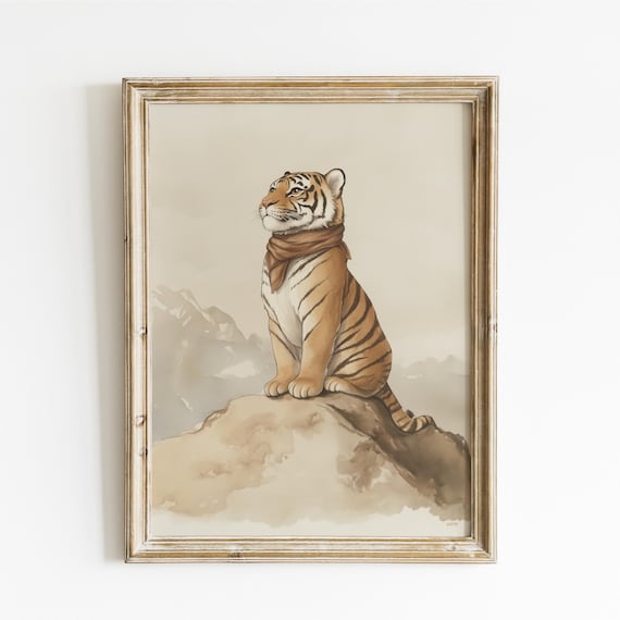 Tiger Cub Wearing Scarf Sitting on Rocky Peak Above Mist Poster