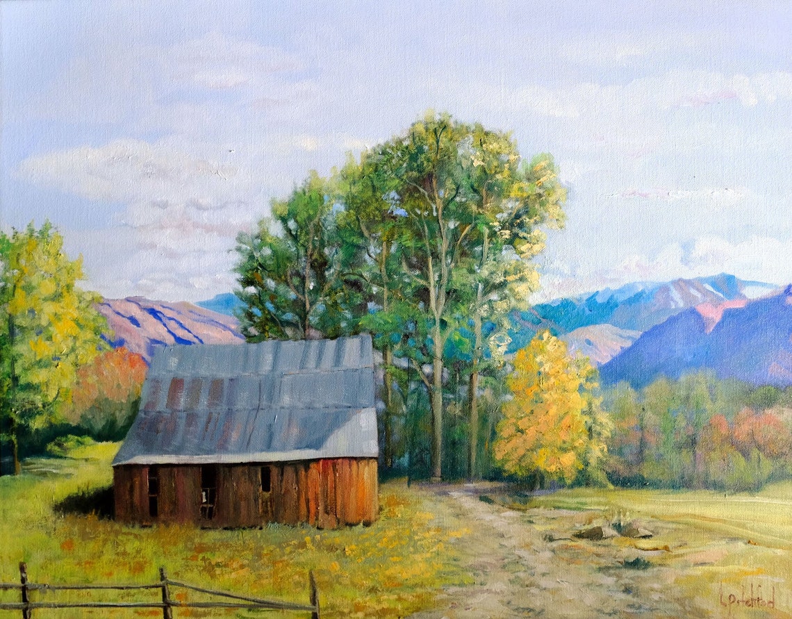 Old Wooden Barn with a Tin Roof Set Against Mountain Peaks Poster