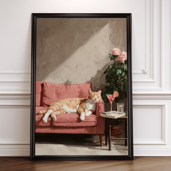 Orange Tabby Cat Napping On Pink Sofa With Cocktail Wall Art