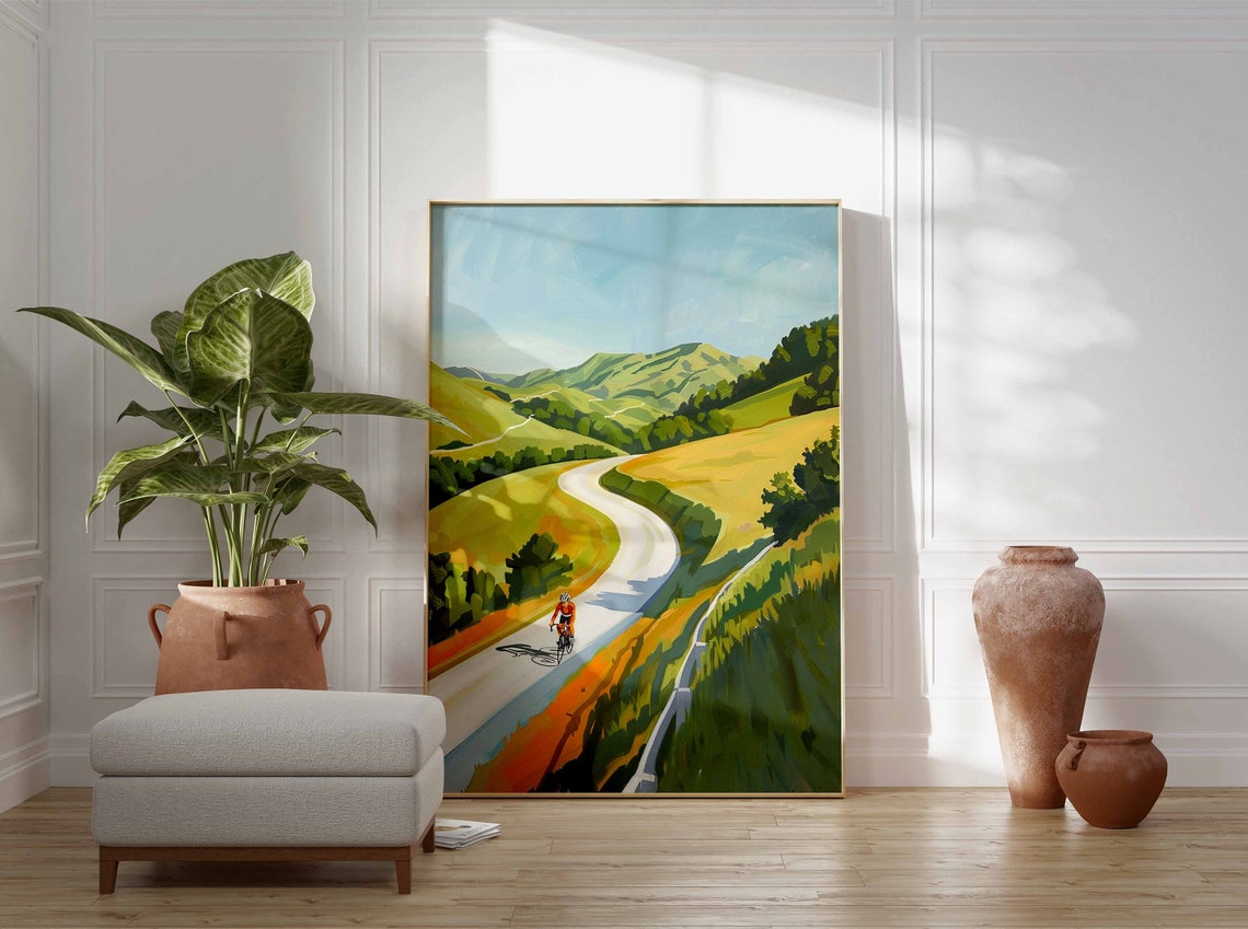 Solo Cyclist Riding Winding Road Through Golden Rolling Hills Poster - Image 3