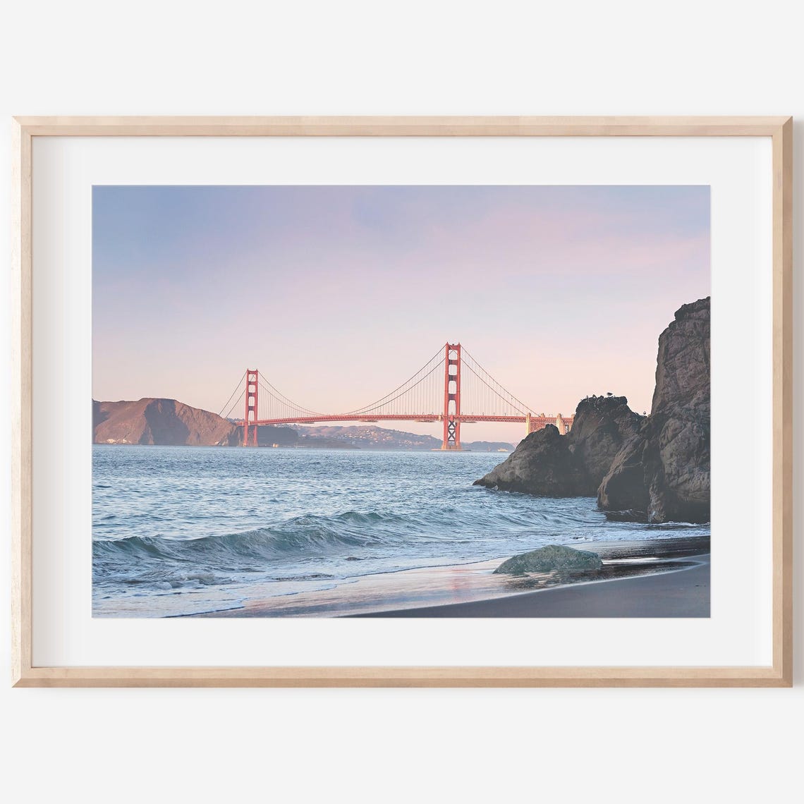 Golden Gate Bridge at Sunset From a Rocky Beach Shore Poster