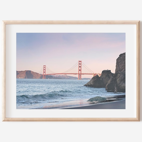 Golden Gate Bridge at Sunset From a Rocky Beach Shore Poster