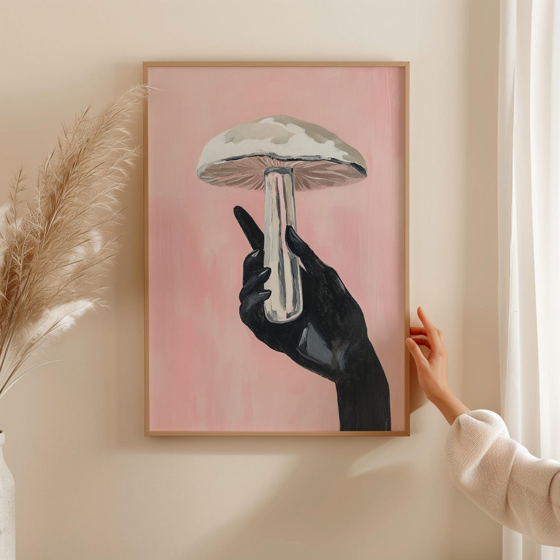 Black Hand Holding a Pale Mushroom on Soft Pink Surreal Poster