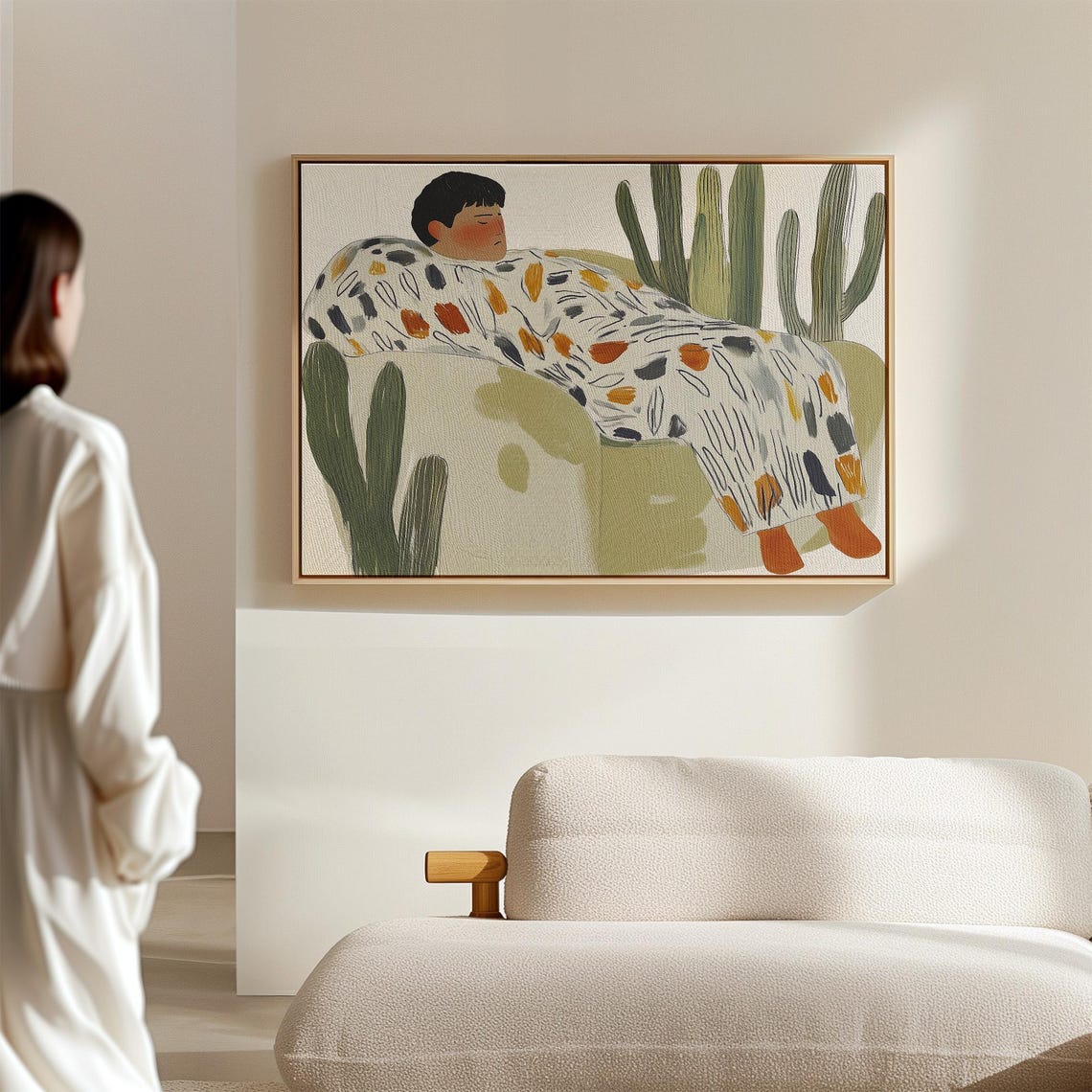 Person Resting on Green Couch Surrounded by Tall Cacti Poster