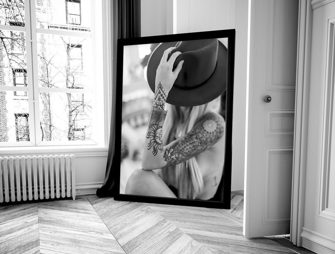 Tattooed Woman Holding Cowboy Hat Over Face Black and White Poster - Image 4