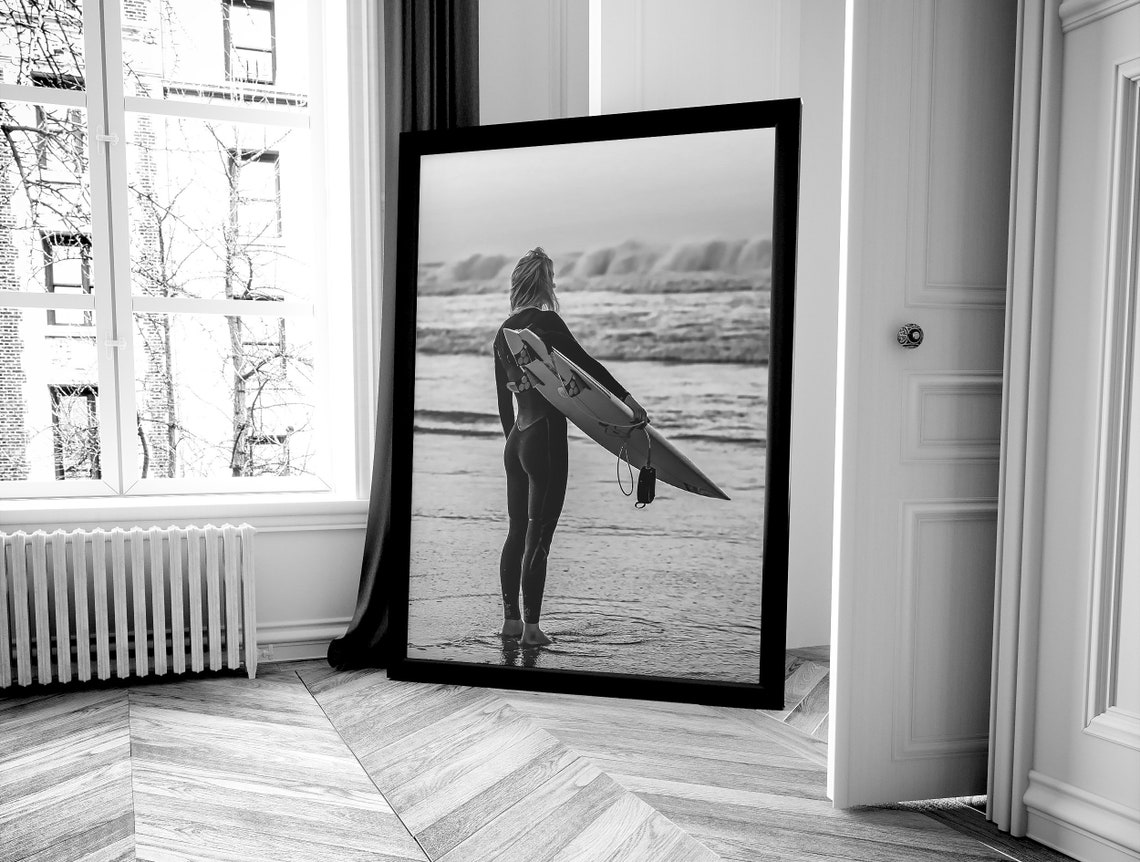 Woman in Wetsuit Holding Surfboard Watching Waves Beach Poster - Image 4