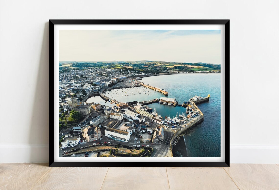 Aerial View of a Seaside Harbor Town with Marina at Golden Hour Poster
