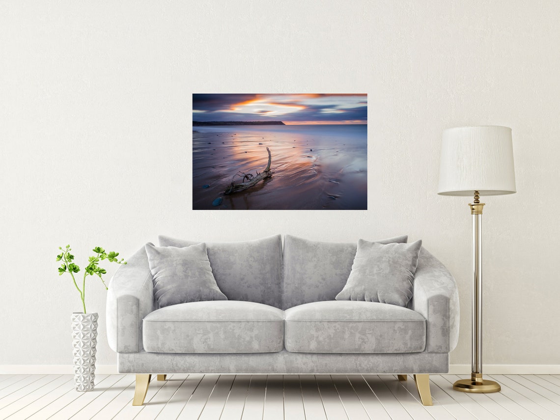 Driftwood Resting on Wet Sand Under a Soft Pink Twilight Sky Poster - Image 2