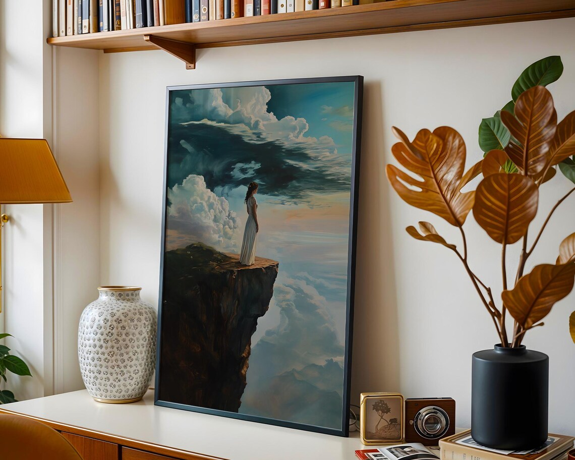 Woman in White Dress Standing on a Cliff Above a Sea of Clouds Poster - Image 3