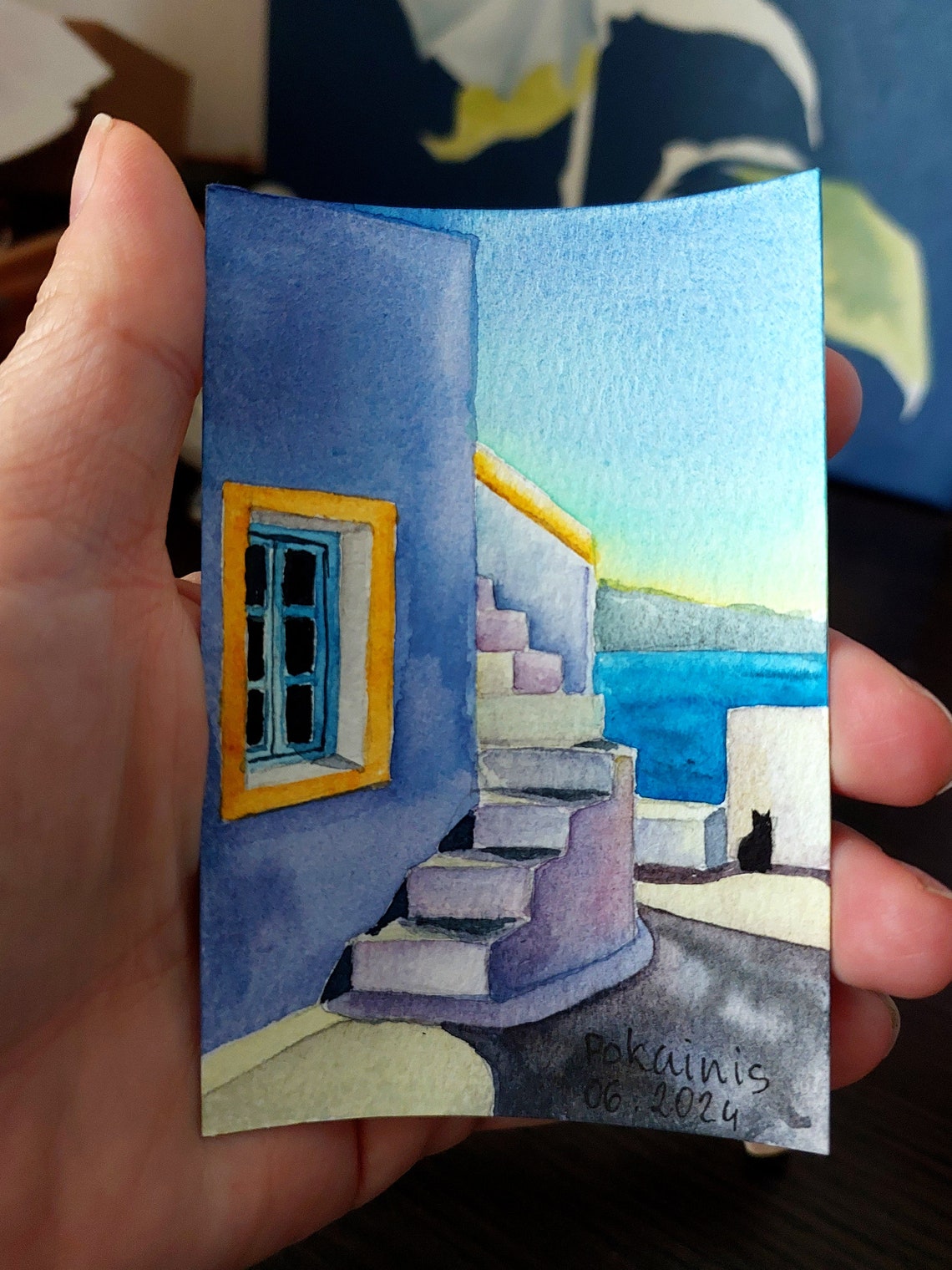 Black Cat Watching Santorini Steps and Blue Window Watercolor Poster