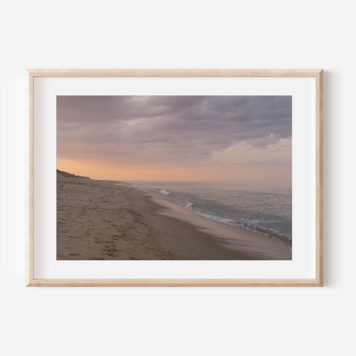 Empty Beach at Sunset Under a Moody Clouded Pink Evening Sky Poster