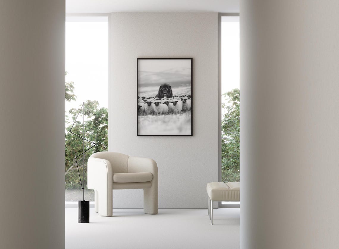 Lion Standing Among Sheep in Snow Black and White Wildlife Poster - Image 3