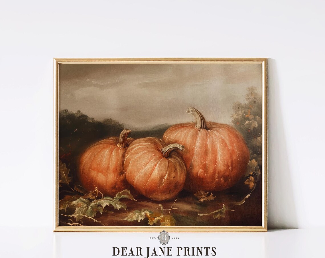 Three Ripe Orange Pumpkins With Autumn Leaves In Soft Light Poster - Image 2