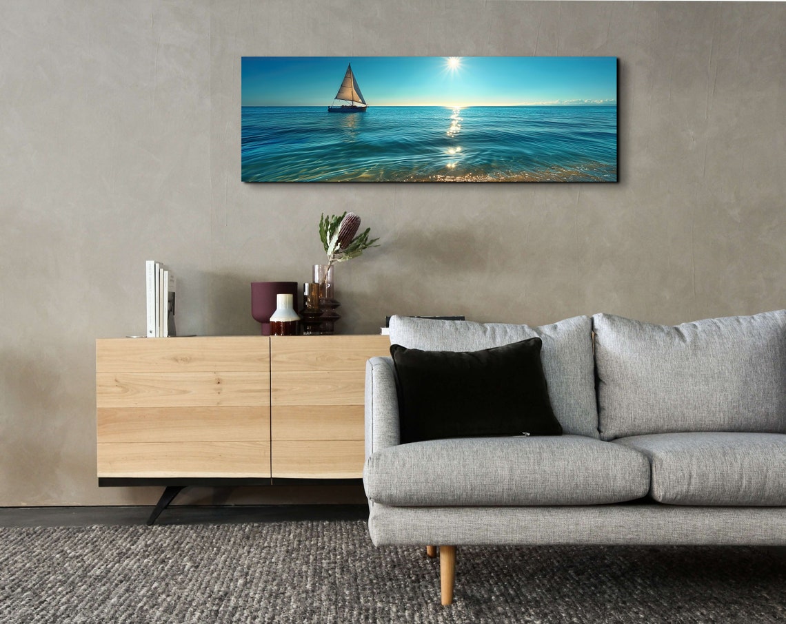 Serene Lone Sailboat Gliding Over a Calm Sunlit Blue Ocean Poster - Image 3
