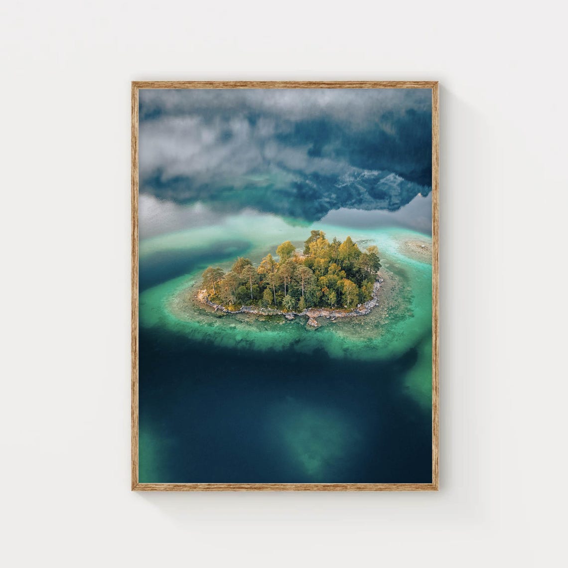 Aerial View of Tiny Forest Island in Turquoise Alpine Lake Poster
