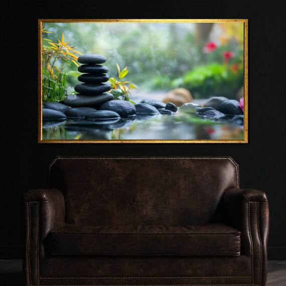 Stacked Dark Zen Stones by the Water in a Lush Garden Poster