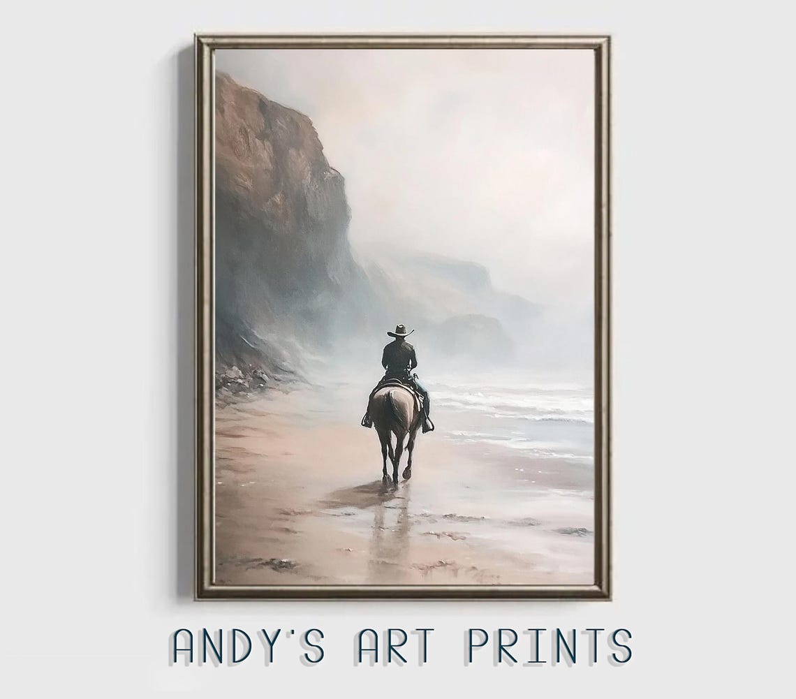 Solitary Cowboy Riding Horse Along A Misty Beach Beneath Cliffs Poster
