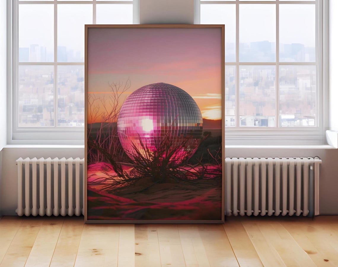 A Giant Disco Ball Resting In A Pink Desert Sunset Landscape Poster