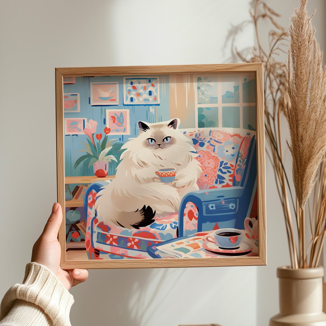Sweet Ragdoll Cat with Teacup on Floral Sofa in Blue Room Poster - Image 3