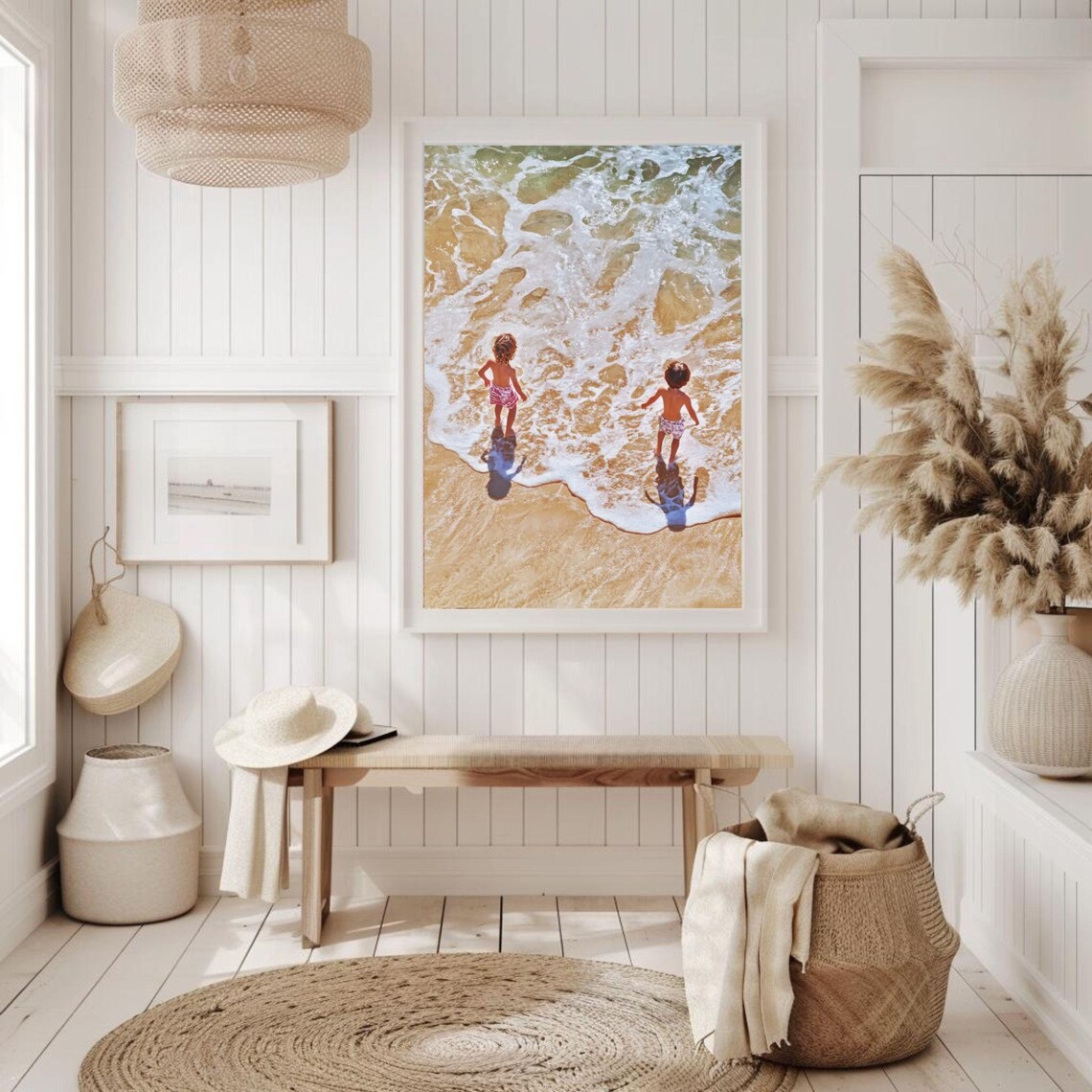 Sunny Aerial Photo of Two Kids Playing at Ocean Shoreline Poster