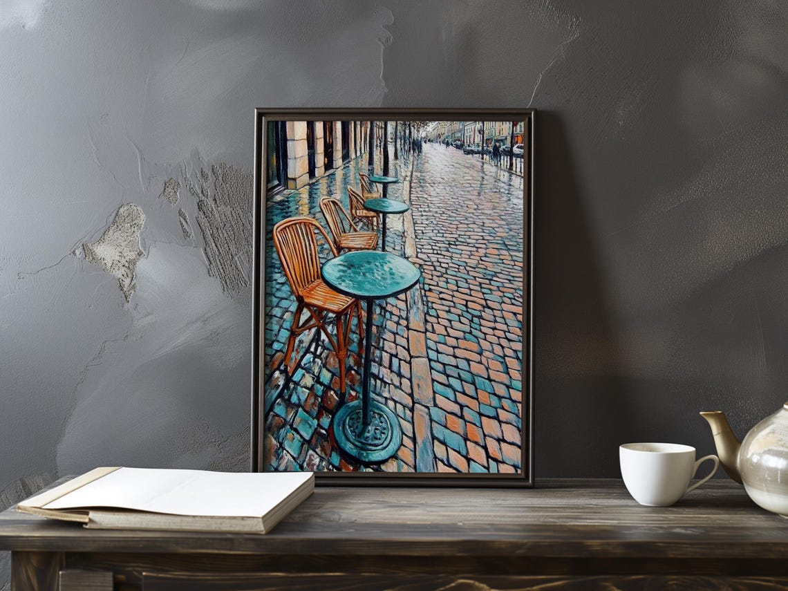 Empty Parisian Cafe Tables and Chairs on Wet Cobblestones Poster