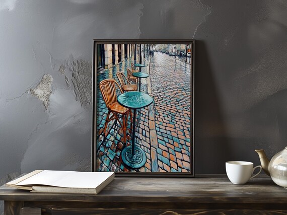 Empty Parisian Cafe Tables and Chairs on Wet Cobblestones Poster