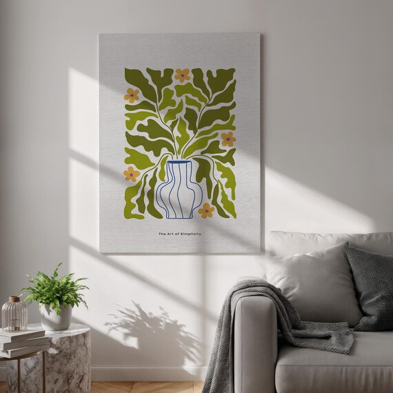 This Botanical Canvas Features Green Leaves In A Striped Vase It Adds Organic Charm To Any Space Framed And Modern Or Boho
