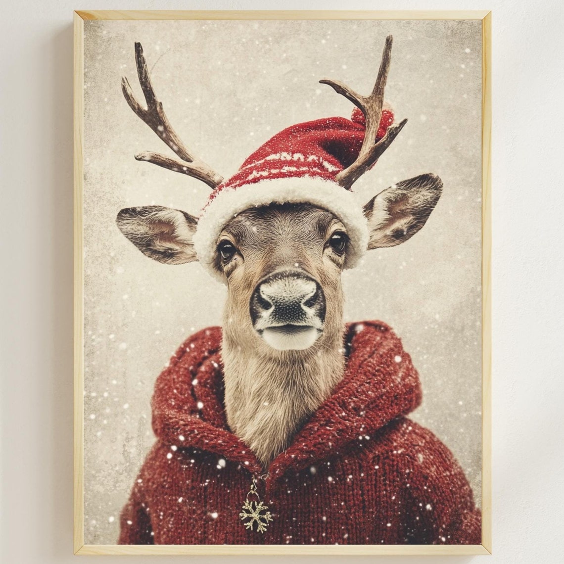 Reindeer Wearing Santa Hat and Red Knit Sweater in Snowfall Poster