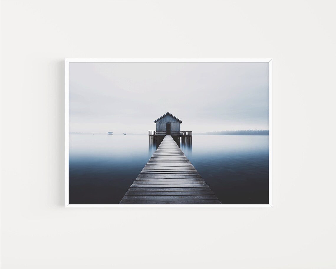 Minimalist Boathouse at End of Wooden Pier on Still Blue Water Poster - Image 2