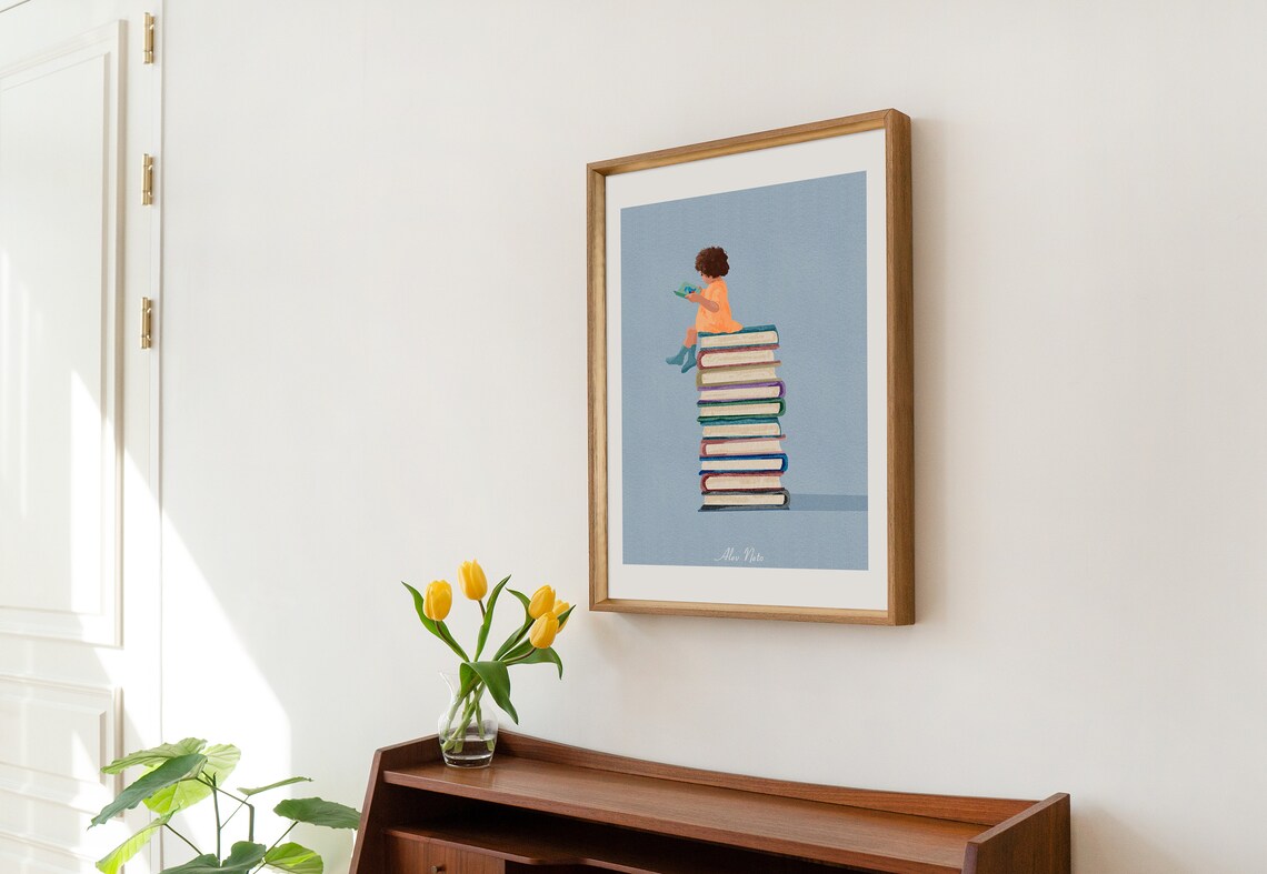 Child Reading Atop a Tall Tower of Colorful Books on Blue Poster - Image 2