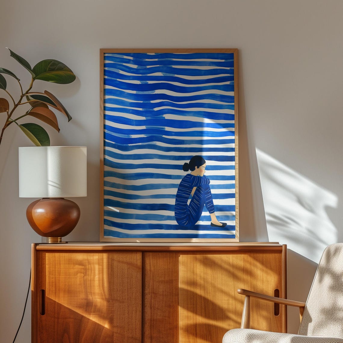 Woman Seated Among Bold Blue Waves in Striped Clothing Poster - Image 3